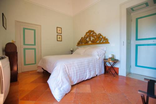 Ένα ή περισσότερα κρεβάτια σε δωμάτιο στο Villa Ceci Dimora di Storie