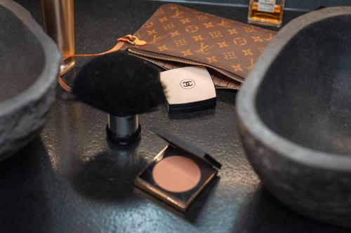 a pile of cosmetics sitting on top of a table at Boutique Apartment Sonnenhang - incl InfinityPOOL in Fliess