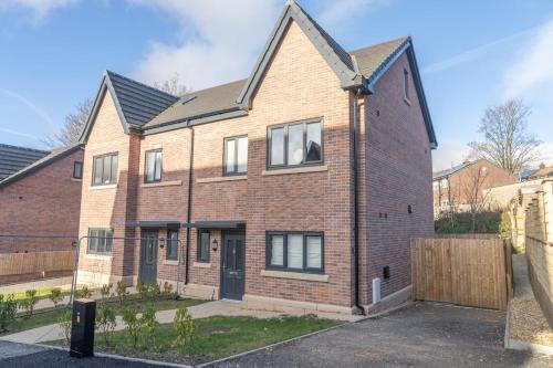 an image of a brick house at The Show Home - Grange Meadows 7 Adults 2 Kids in Mossley