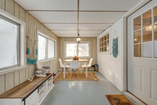 a kitchen with a table and chairs in a room at The Babbling Brooke in Blakeslee