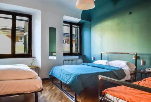 Postel nebo postele na pokoji v ubytování OStellin Genova Hostel