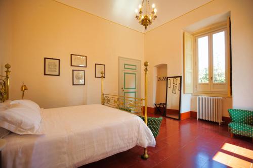 Postel nebo postele na pokoji v ubytování Villa Ceci Dimora di Storie