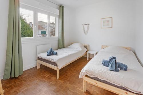 Postel nebo postele na pokoji v ubytování La Catinou - Maison confortable et spacieuse
