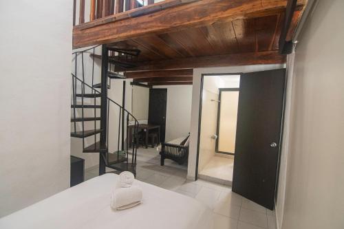 Postel nebo postele na pokoji v ubytování Hotel Maya Turquesa