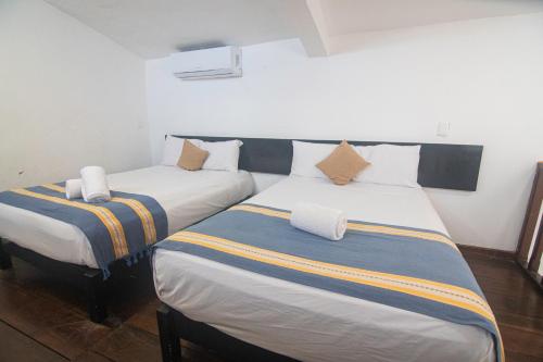 Postel nebo postele na pokoji v ubytování Hotel Maya Turquesa