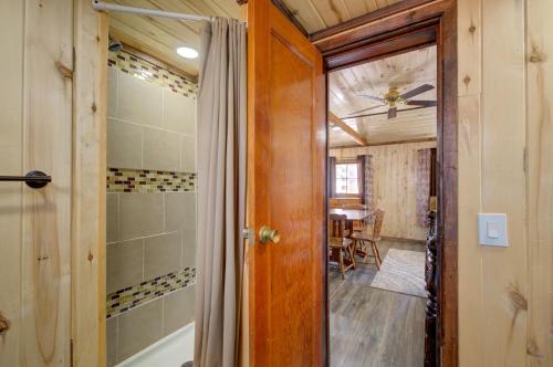 a bathroom with a shower and a tub in a room at Winmar Cabins in Twin Lakes