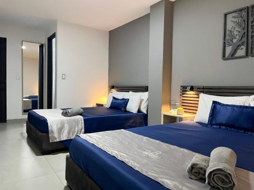 Postel nebo postele na pokoji v ubytování Hotel Encanto