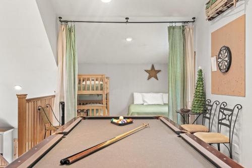 a living room with a pool table in it at Belleayre Mountain House in Arkville