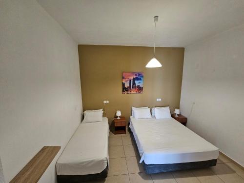 Posteľ alebo postele v izbe v ubytovaní Elounda Sunrise Apartments