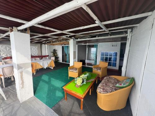 Posezení v ubytování HOSTAL LAMAR BARU dónde Gertrudis