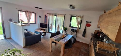 a living room with a couch and a table at Le Petit Lu in Leysin