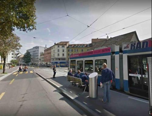a group of people sitting on a bench on a street at KAYA Zurich Apartment 3B - Downtown 2BR Deluxe Apt in Zürich