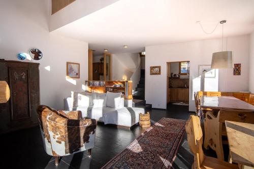 a living room with a couch and chairs at Chalet a Saint Moritz with Sauna Privata in Pontresina
