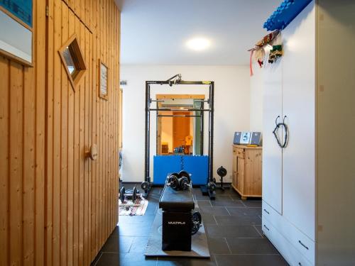 a room with a couch and a mirror on the wall at Chalet a Saint Moritz with Sauna Privata in Pontresina