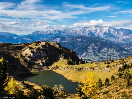 a mountain view of a lake in the mountains at Gamslodges in Goldegg