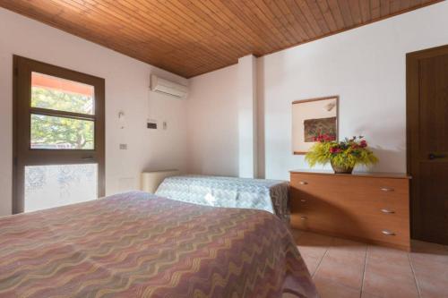 En eller flere senge i et værelse på Agriturismo Le Mimose