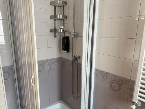 a shower with a phone in a bathroom at Bed and Breakfast Aereoparking in Naples