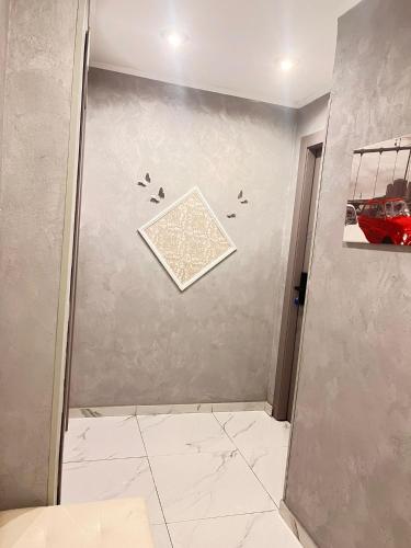a bathroom with a shower with birds on the wall at Infinity Passion in Rho