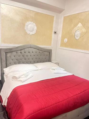 a bed with a red blanket on top of it at Infinity Passion in Rho