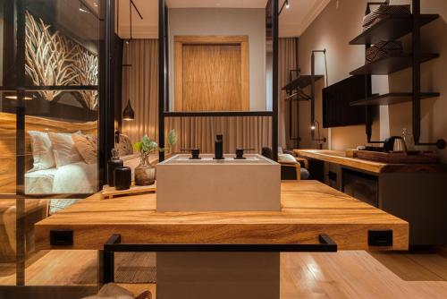 a kitchen with a sink in a room at Mater Hotel in Canela