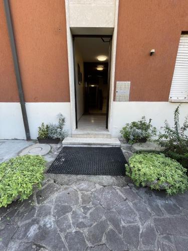 a hallway of a building with a door open at A UN PASSO DALL'OSPEDALE in Padova