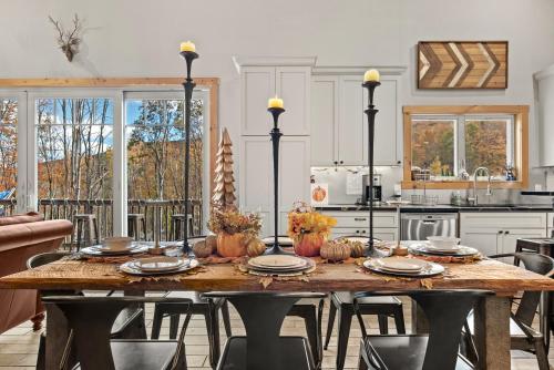 a kitchen with a wooden table with pumpkins on it at Belleayre Mountain House in Arkville