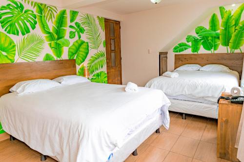 Postel nebo postele na pokoji v ubytování Hotel Ariana