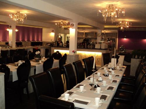 Restorāns vai citas vietas, kur ieturēt maltīti, naktsmītnē FeWo am Mu-Cafe