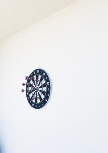 a dartboard hanging from the ceiling of a room at Villa Moro: Beachfront Privacy in Trstenik