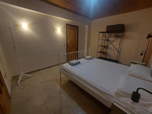 a bedroom with a large bed in a room at Angelos House in Ýpsos