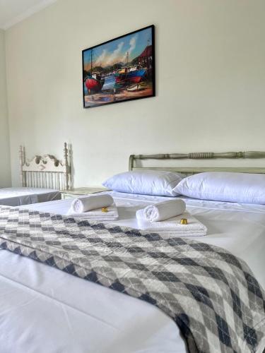 Postel nebo postele na pokoji v ubytování Pousada Casa Contos de Minas