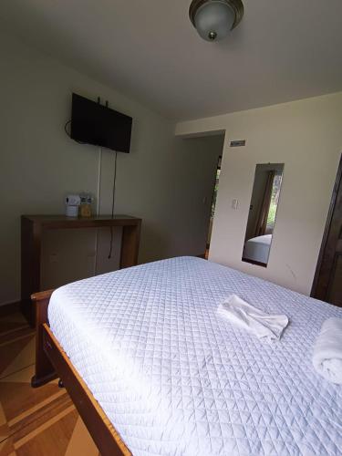 Postel nebo postele na pokoji v ubytování Hotel Ariana
