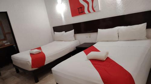 Postel nebo postele na pokoji v ubytování Hotel Maya Turquesa