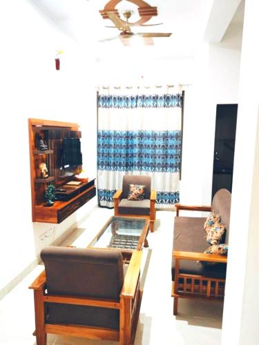 a living room with a couch and a table at Usha Residency in Varanasi