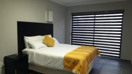 Ένα ή περισσότερα κρεβάτια σε δωμάτιο στο Guest house