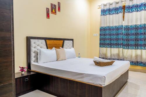 a bedroom with a large bed in a room at Usha Residency in Varanasi