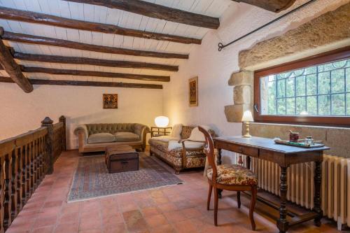 a living room with a couch and a table at CC-1 Casa Mar y Viñas in Begur