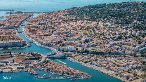an aerial view of a city with a harbor at Bo'Zen in Clermont-lʼHérault