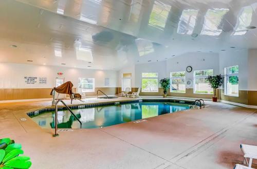 a large pool in a large room with a large ceiling at The Islander- Luxurious Beach Property in Hilton Head Island