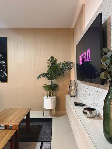 TV a/nebo společenská místnost v ubytování Hotel Encanto