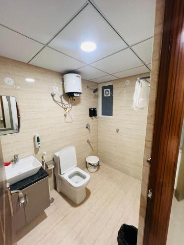 a bathroom with a toilet and a sink at The Sleepy Monkey in Jaipur