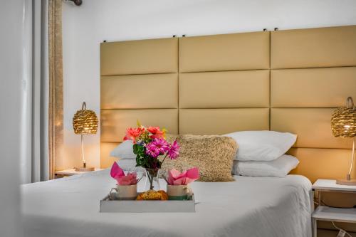 a bedroom with a large bed with flowers on it at Heated pool just 1.7 mi to beach The Ocean Pearl in Sarasota
