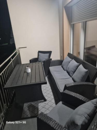 a living room with a table and a couch at Ferienwohnung Maitschern in Wörschach