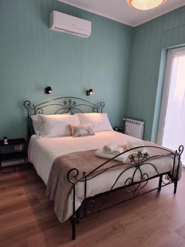 a bedroom with a bed with a metal frame at Civico 34 Urban House in Ciampino