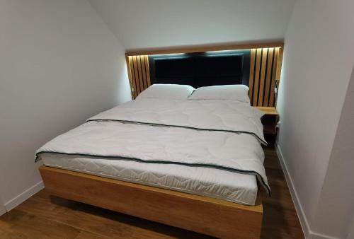 Postel nebo postele na pokoji v ubytování Domki z Balią Korzenie Pruchnik