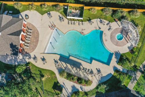 an aerial view of a resort with a swimming pool at Seaside Comfort in Gulfport