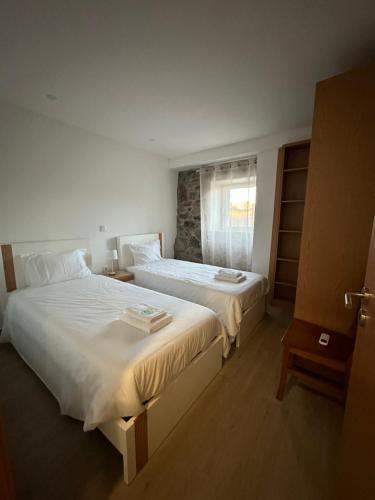 Ένα ή περισσότερα κρεβάτια σε δωμάτιο στο Casa do Beija
