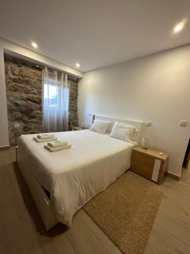 Ένα ή περισσότερα κρεβάτια σε δωμάτιο στο Casa do Beija