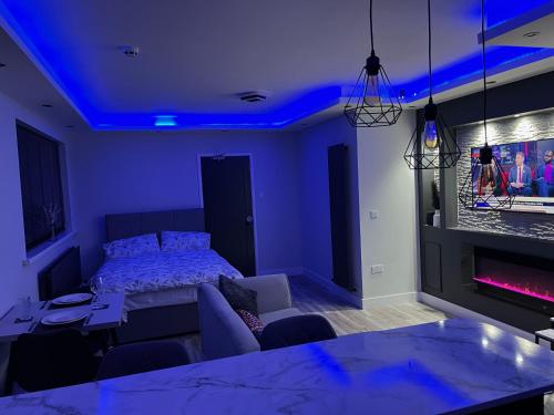 a bedroom with a bed and a blue ceiling at Modern Junior Suite, Seascale, Cumbria in Seascale