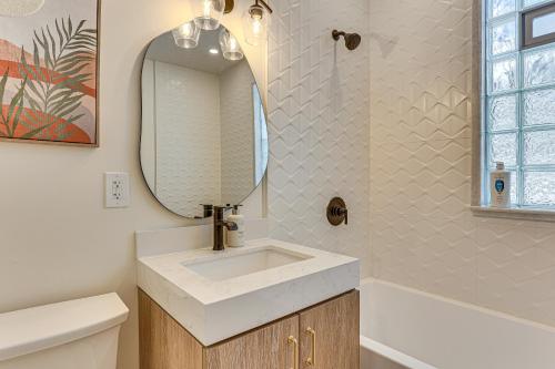 a bathroom with a sink and a mirror at 3 Mi to Downtown Youngstown Updated Apartment in Youngstown